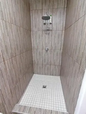 a bathroom with a shower with a tiled shower at Purdy's Place in Louis Trichardt