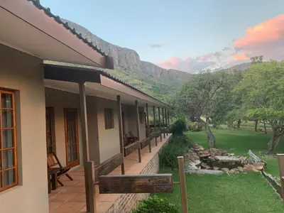 a house with a view of the mountains at Kransberg Country Lodge Guest Farm in Thabazimbi