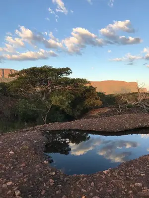 a reflection of the sky in a pool of water at Kransberg Country Lodge Guest Farm in Thabazimbi