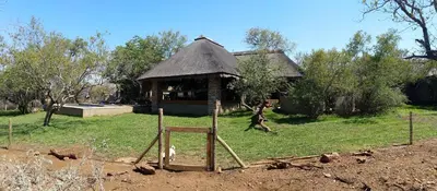 a gazebo in front of a house at Call of the Wild Lodge in Hoedspruit