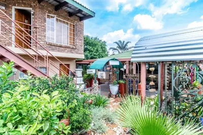 a house with a garden in front of it at Berghaan Pretoria in Pretoria