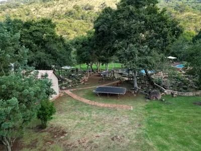 an overhead view of a park with a bench and trees at Rocky Drift Private Nature Reserve in Waterval Boven
