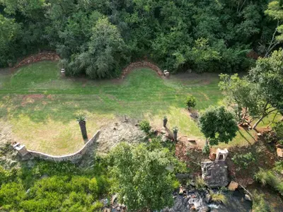 an aerial view of a park with trees and grass at Rocky Drift Private Nature Reserve in Waterval Boven