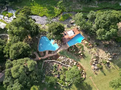 an overhead view of an estate with a swimming pool at Rocky Drift Private Nature Reserve in Waterval Boven