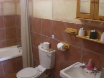 a bathroom with a toilet and a sink at Haus Kopatsch in Hazyview
