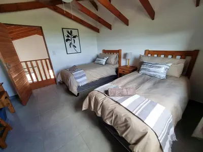 a bedroom with two beds in a room at Sondela Nature Reserve & Spa Chalets in Bela-Bela