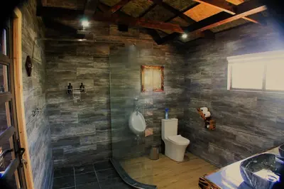 a bathroom with a urinal and a toilet at Abendruhe Lodge in Pretoria