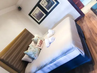 an overhead view of a bed with towels and pillows at Spacube Luxury Suites and Spa in Pretoria