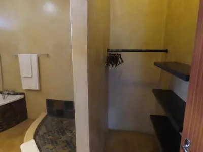 a bathroom with a shower and a sink at Sunset Lodge & Safaris in Guernsey Nature Reserve