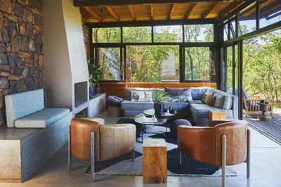 a living room with a couch and a table at Marataba Mountain Lodge in Kransberg