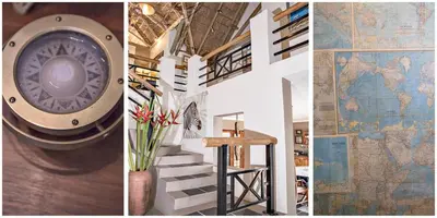 a room with a map on the wall and a staircase at Utopia in Africa Guest Villa in Nelspruit