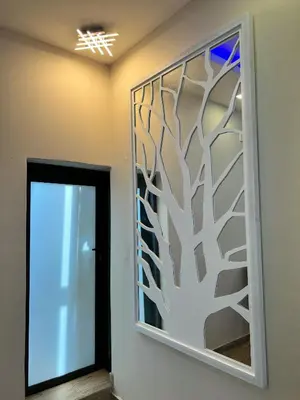 a wall mural with a tree cut out at Aerodrome Lodge and Conference Centre in Benoni