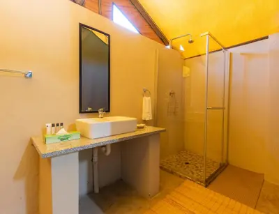 a bathroom with a sink and a shower at Lions Rock Rapids - Luxury Tented Camp in Hazyview