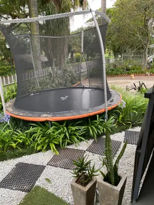 a trampoline in a dome in a garden at White River B & B in White River
