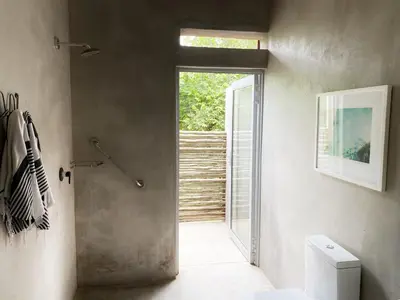 a bathroom with a shower and a toilet at Nextdoor Kruger in Marloth Park