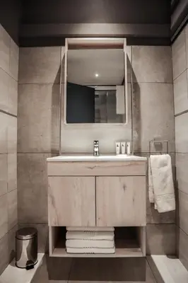a bathroom with a sink and a mirror at Cascades Guest Lodge in Nelspruit