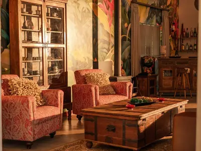 a living room with two chairs and a coffee table at Monkey Thorn Lodge & Wellness Spa - Adults Only in White River