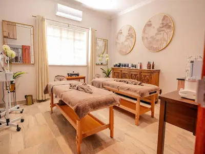 a hospital room with two beds and a window at Monkey Thorn Lodge & Wellness Spa - Adults Only in White River