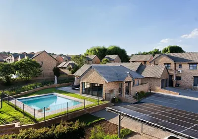 an aerial view of a house with solar panels at Kyalami Creek in Midrand