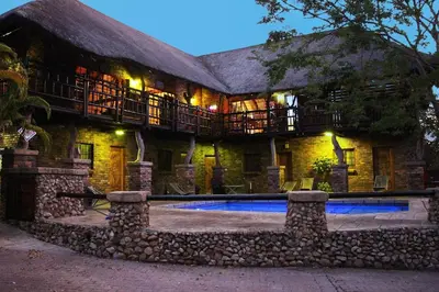 a house with a swimming pool in front of it at Flight of the Eagle @ Kruger in Marloth Park