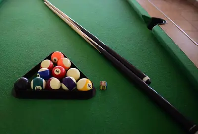 a packet of billiard balls on a pool table at Indlovukazi Guesthouse in Hartbeespoort