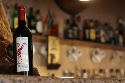 a bottle of wine sitting on top of a counter at African Rock Lodge in Hoedspruit