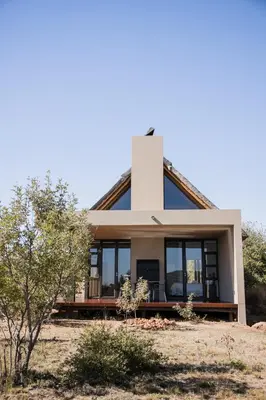 a house in the middle of a field at Kuwisa Lodge in Bela-Bela