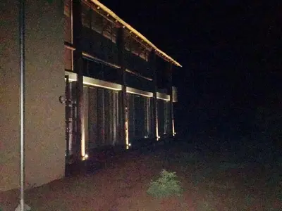 a building at night with the lights on at Kuwisa Lodge in Bela-Bela