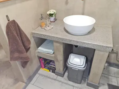 a bathroom with a sink and a bowl on a counter at Serendipity NO TV in Polokwane