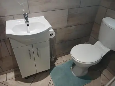 a bathroom with a white toilet and a sink at Serendipity NO TV in Polokwane