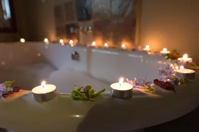 a group of candles sitting on top of a bath tub at Kambaku Safari Lodge in Timbavati Game Reserve
