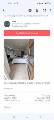 a screenshot of a website with a bed in a room at Stay at Home Airport Lodge in Kempton Park