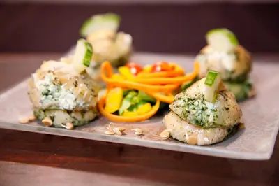 a plate of food with vegetables and meatballs at Lalapanzi Hotel & Conference Centre in Bandelierkop