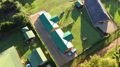 an overhead view of a group of houses with roofs at Misty Cottage in Dullstroom