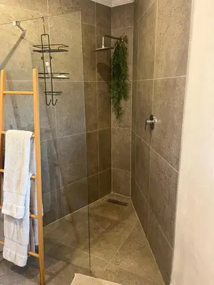 a bathroom with a shower with a glass door at Annie's Place in Kempton Park