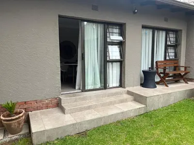 a house with a set of stairs leading to a patio at Annie's Place in Kempton Park
