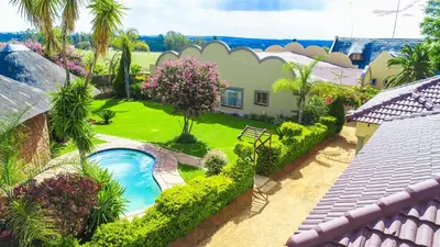 an aerial view of a yard with a swimming pool at Mmakosha Lodge in Pretoria