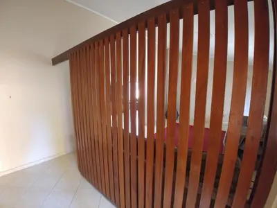 a wooden stair railing in a room at 22 on Nicol in Secunda