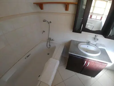a bathroom with a sink and a bath tub and a sink at 22 on Nicol in Secunda