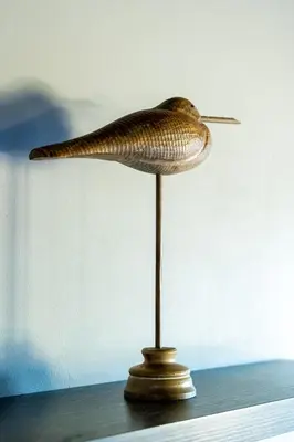 a statuette of a bird on a stand at 7th Hole Golf Lodge in Modimolle