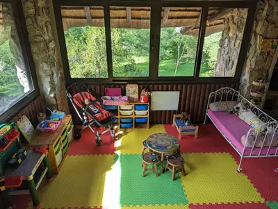 a childs room with a bunk bed and a play area at Hasekamp Hospitality in Hoedspruit