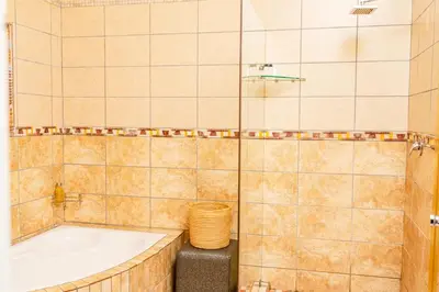 a bathroom with a tub and a sink at Re-Union Vacations in Hartbeespoort