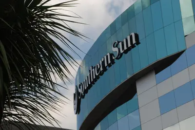 a sign on the side of a building at Southern Sun OR Tambo International Airport in Kempton Park