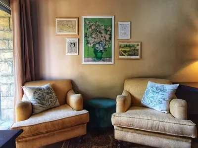a living room with two chairs and a couch at Camellia Haven in Pretoria