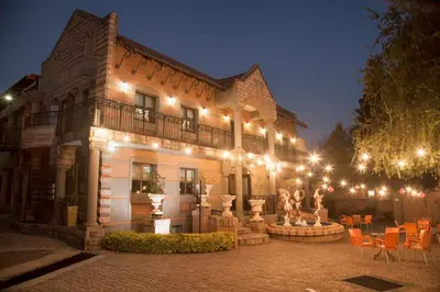 a large building with lights on the side of it at Casa Toscana Lodge in Pretoria