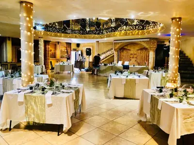 a banquet hall with tables with white tablecloths at Casa Toscana Lodge in Pretoria