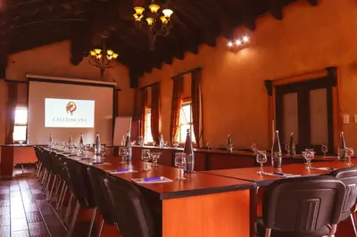 a conference room with a long table and chairs at Casa Toscana Lodge in Pretoria