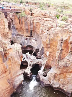 a canyon with a bridge and water in it at Sabie Self Catering Apartments in Sabie