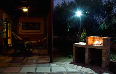 a light shines on a patio at night at Baobab - NUDE - SunEden Family Naturist Resort in Pretoria