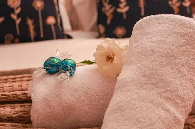 two blue glass bead earrings sitting on a towel at Diamantvallei Landgoed in Rayton